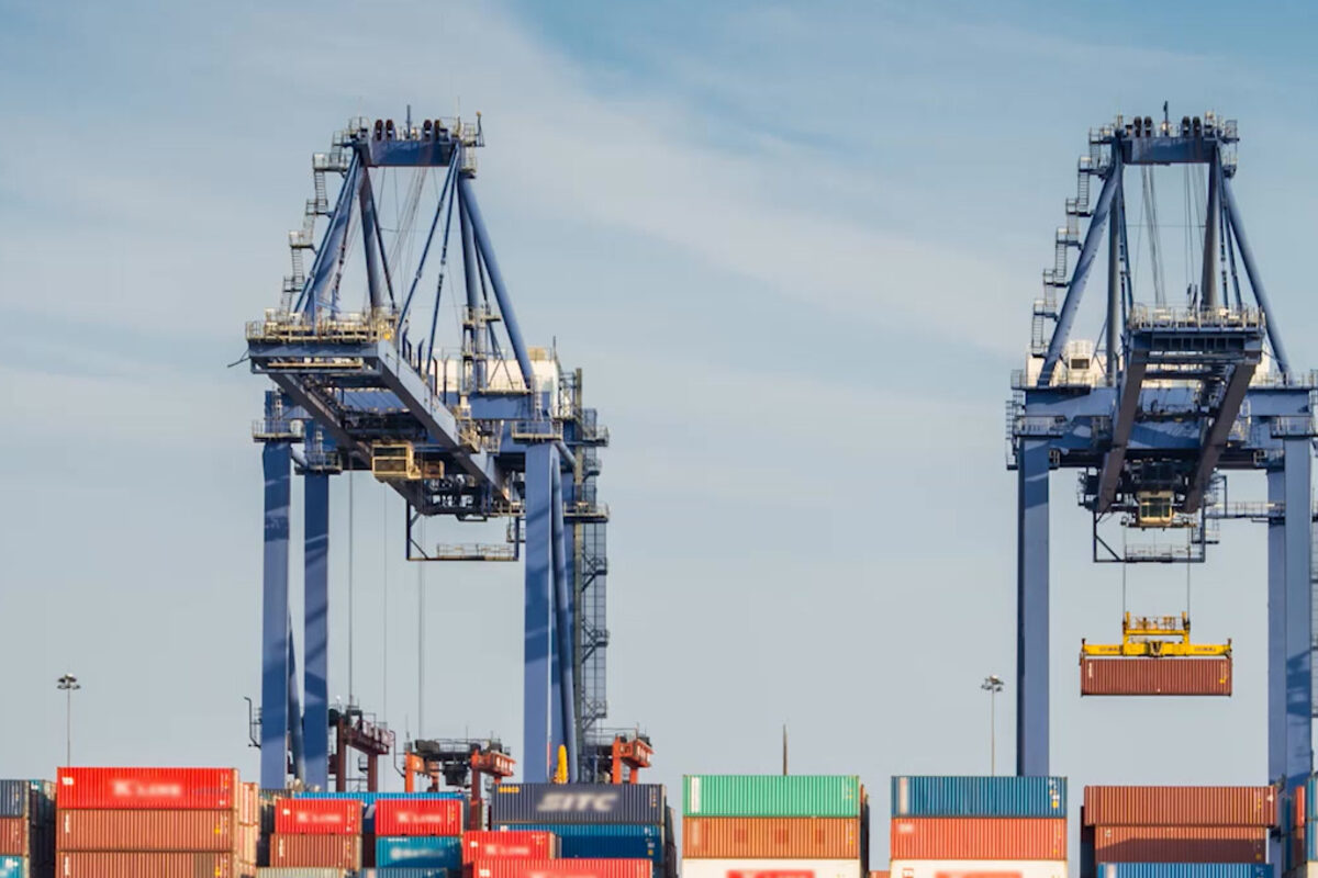 Gantry cranes lifting containers dockside